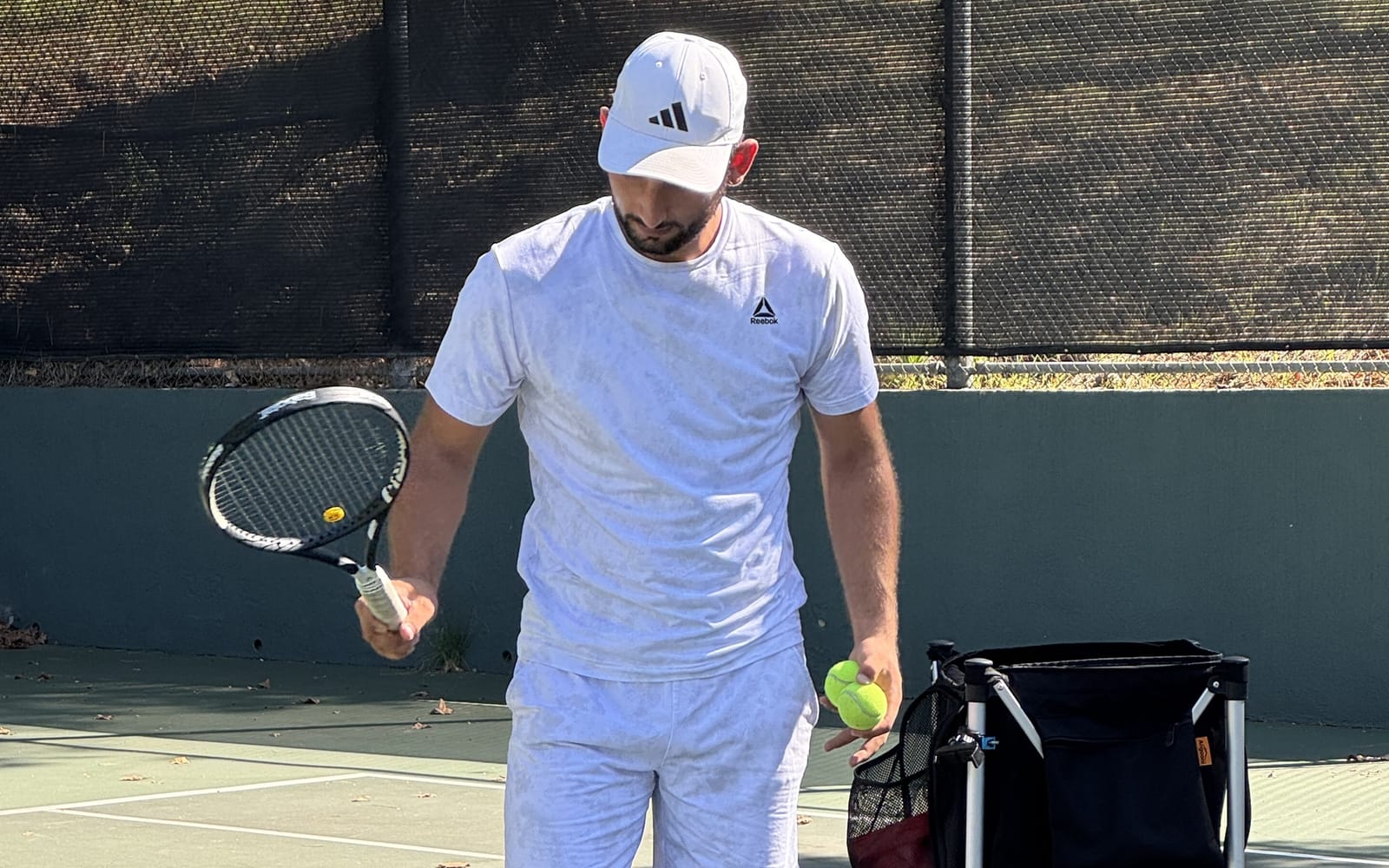 Small group tennis lesson in the Pasadena area, coach feeding to players
