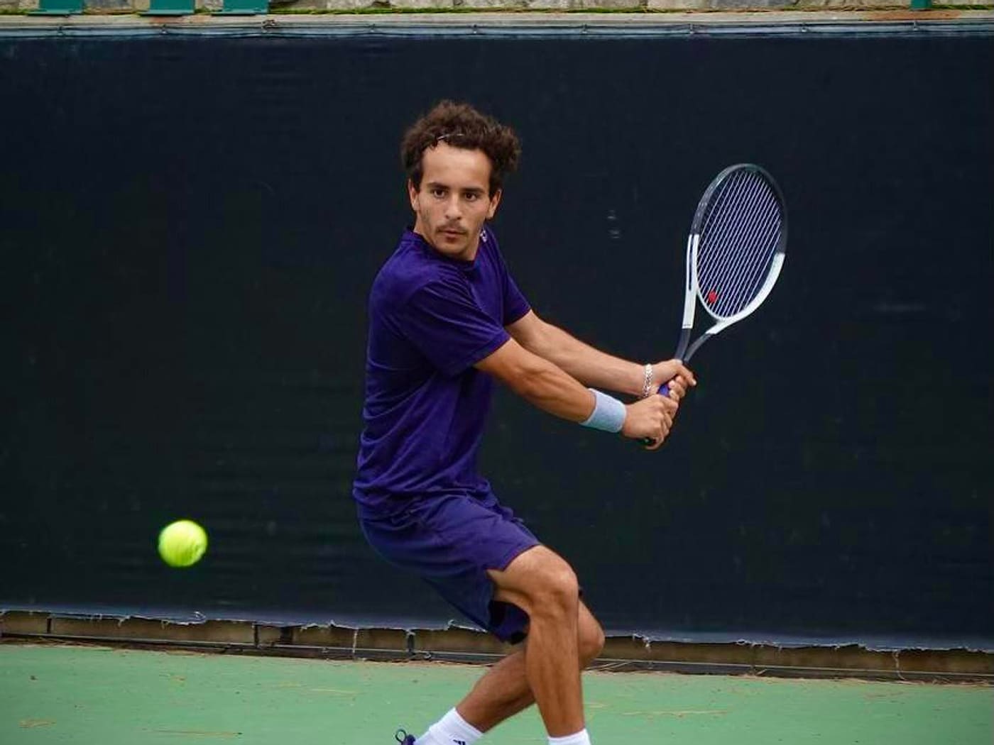 Live-ball backhand during competitive practice — high-level tennis hitting partner in Los Angeles