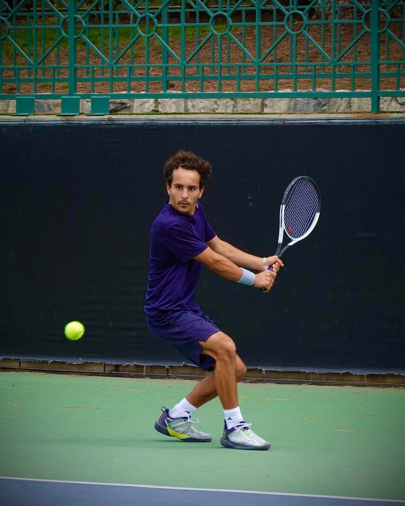 Markos Mkrtchyan hitting a backhand during a match — private tennis coach in Pasadena, California