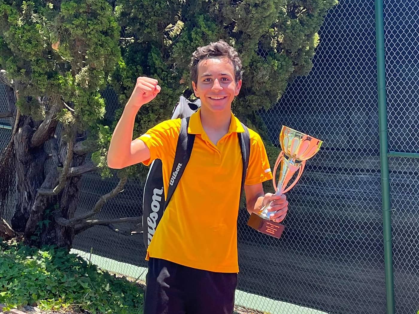 Markos Mkrtchyan with a junior tournament trophy in Los Angeles