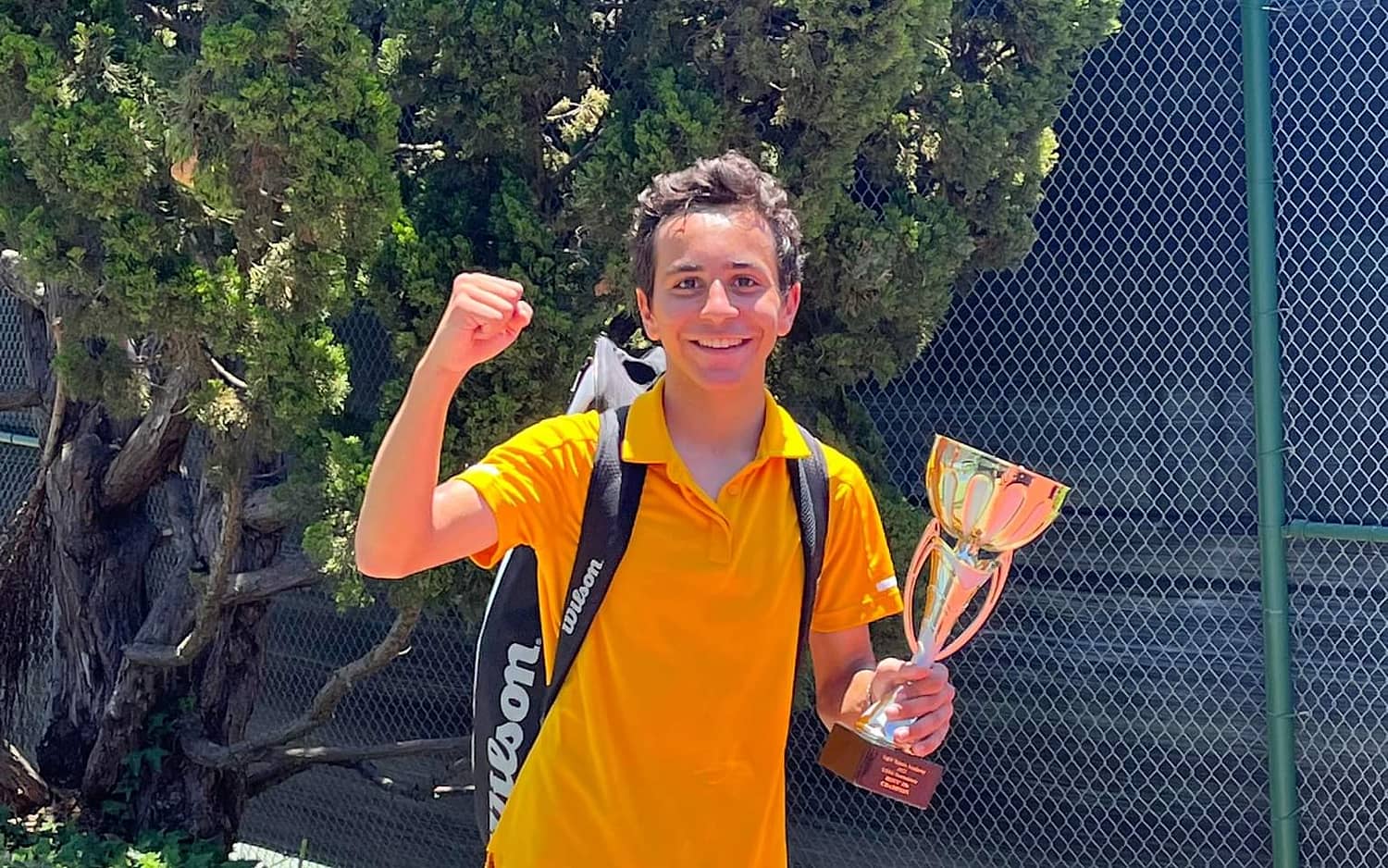 Markos Mkrtchyan after winning a junior tournament — competitive tennis training in Los Angeles