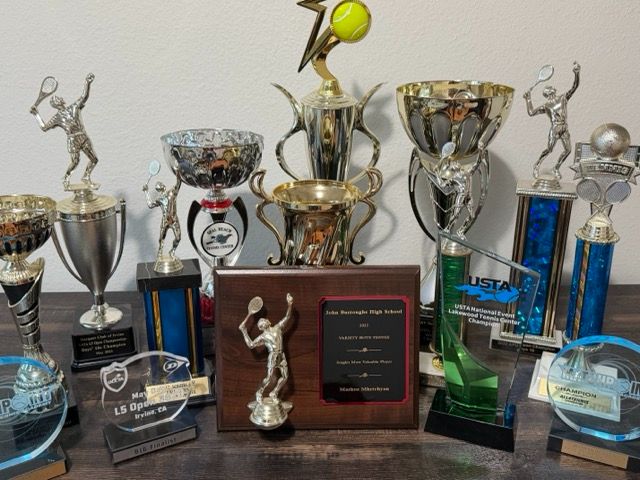 Collection of tennis trophies and awards